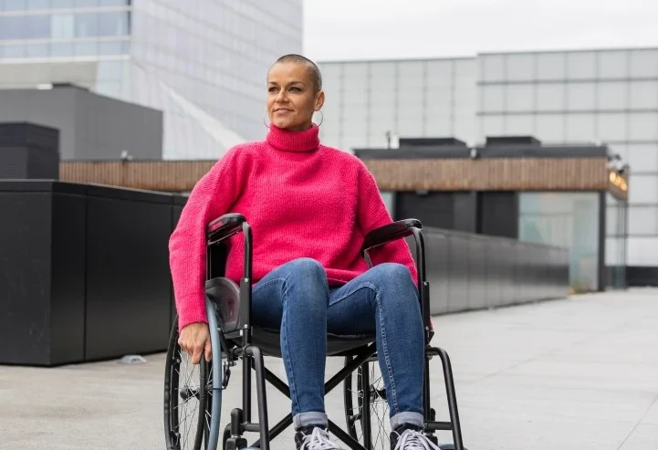 Happy disabled woman in wheelchair